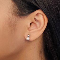 Photo of worn 5mm Sphere Earrings in White Gold and 5.5mm Fresh Water Pearl