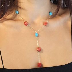 photo of worn Y Necklace in Yellow Gold and Red Coral and Turquoise
