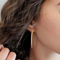 Photo of worn Knurled half-moon earrings
