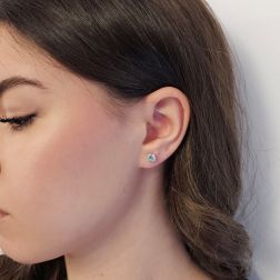 Photo of worn Solitary Studs earrings with round 5.80mm acquamarines in 18kt white gold