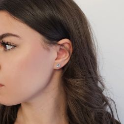 Photo of worn Solitary Studs earrings with round 6.20mm acquamarines in 18kt white gold