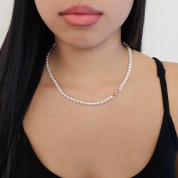 Photo of worn Freshwater pearl necklace with a round clasp in 18kt rose gold