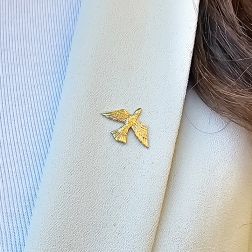 photo of worn Yellow Gold Bird Brooch