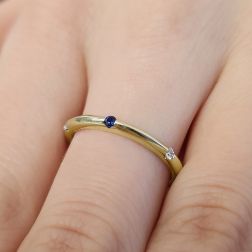 Photo of worn Thin Pyramid Band with Diamonds, Blue Sapphire, Ruby, Emerald on Yellow Gold