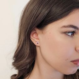 Photo of worn Point of Light Earrings with Rubies and 24 Diamonds
