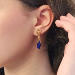 Photo of worn Yellow Gold Pendants with Blue Lapis Stars