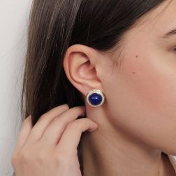 Photo of worn Round Cabochon Lapis earrings with a Diamond border Bi-colour