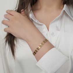 photo of worn Segmented Bracelet with Leaf Motifs and Twisted Chain in Yellow Gold