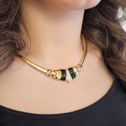 Photo of worn Yellow Gold segmented necklace with Onyx and pavé Diamonds