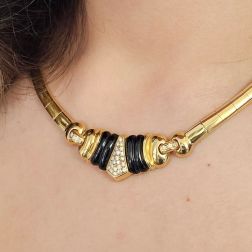 Photo of worn Yellow Gold segmented necklace with Onyx and pavé Diamonds