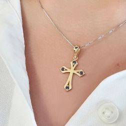 Photo of worn Gothic Cross Pendant in Yellow Gold with Blue Sapphires