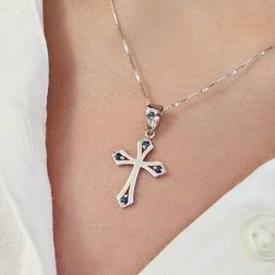 Photo of worn Gothic Cross Pendant in White Gold with Blue Sapphires