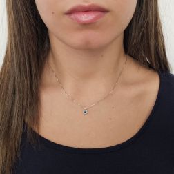 Photo of worn Light Point Blue Sapphire on 0.5mm Venetian Necklace Surrounded by White Gold