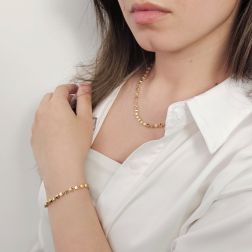 Photo of worn Three-dimensional trapezoid necklace in yellow gold
