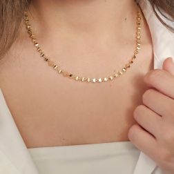 Photo of worn Three-dimensional trapezoid necklace in yellow gold