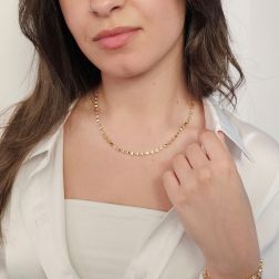 Photo of worn Three-dimensional trapezoid necklace in yellow gold