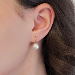 Photo of worn 9.5mm Akoya Pearl Classic Hook Earrings in Yellow Gold