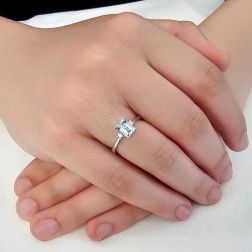 Photo of worn 7x5mm Octagonal Aquamarine Solitaire Ring with 2 Diamonds in White Gold