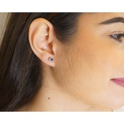 Photo of worn Sapphire Earring Surrounded with Diamonds