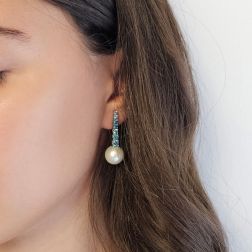 Photo of worn White Gold scalar Tennis Earrings with Blue Diamonds and Freshwater Pearls