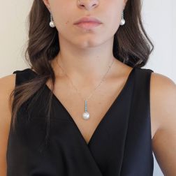 Photo of worn White Gold Tennis Necklace with Blue Diamonds and a Freshwater Pearl