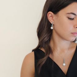 Photo of worn White Gold Tennis Necklace with Blue Diamonds and a Freshwater Pearl