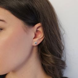Photo of worn Sapphire Earring Surrounded with Diamonds