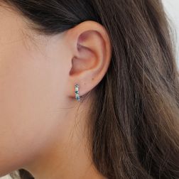 Photo of worn Trilogy Blue Diamond and Diamond hoops