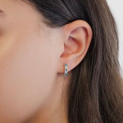 Photo of worn Trilogy Blue Diamond and Diamond hoops
