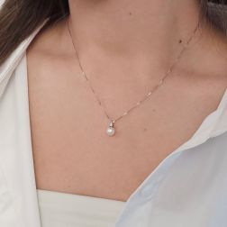 Photo of worn 6.5mm Akoya Pearl Necklace with a 0.036ct Diamond