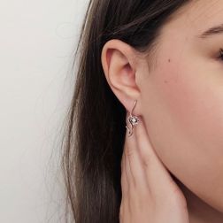Photo of worn Blossom Wave Flower Earrings with Diamonds