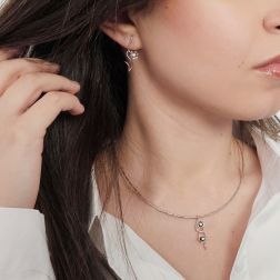 Photo of worn Blossom Wave Flower Earrings with Diamonds