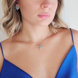 Photo of worn Starfish Pendant with Blue Diamonds in White Gold