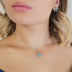 Photo of worn Starfish Pendant with Blue Diamonds in White Gold