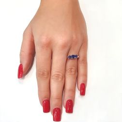 Photo of worn Blue Sapphires Graded Trilogy Ring in White Gold