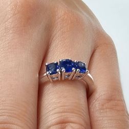 Photo of worn Blue Sapphires Graded Trilogy Ring in White Gold
