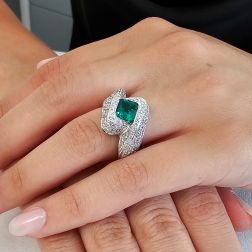 photo of worn Imperial Ring with an Octagonal Emerald and 124 Diamonds