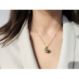 Photo of worn Gold Ladybug on Bronze Leaf Pendant