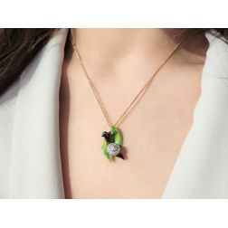 Photo of worn Gold Snail on Bronze Leaf Pendant