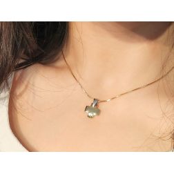 Photo of worn yellow gold short cross with white gold attachment