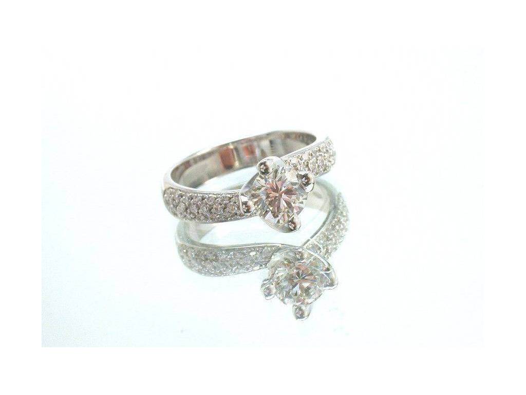 Surrounded Solitaire Ring