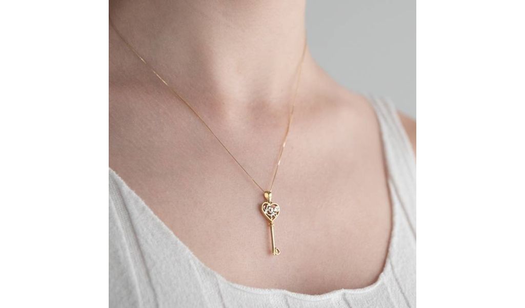 Love pendants in 18kt gold.