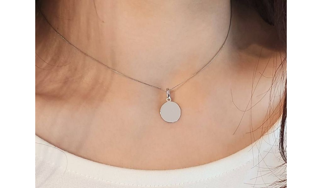 18kt gold pendants that can be personalized with engraving.